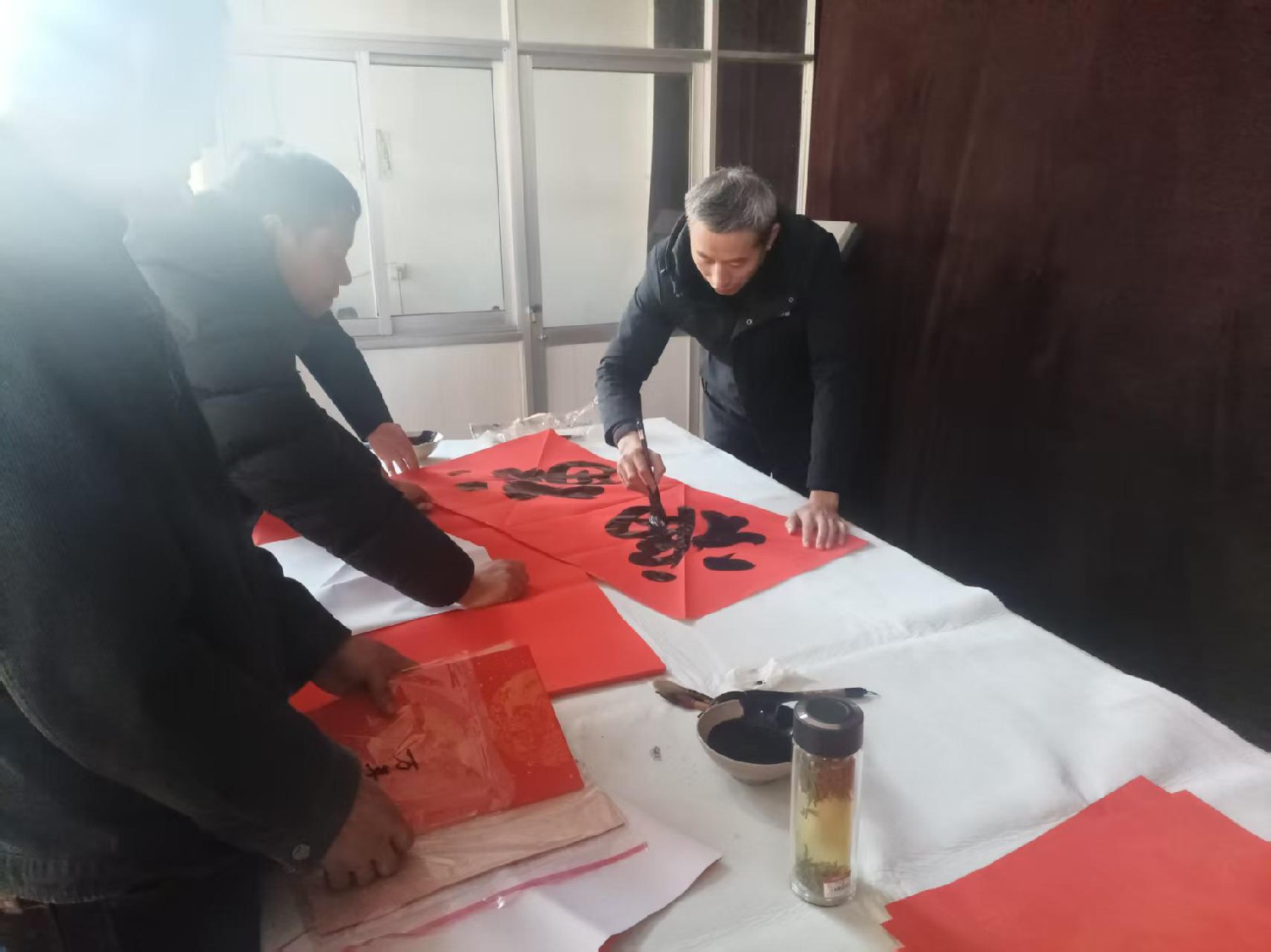 級索煤礦開展“寫春聯(lián) 送祝?！被顒? align=